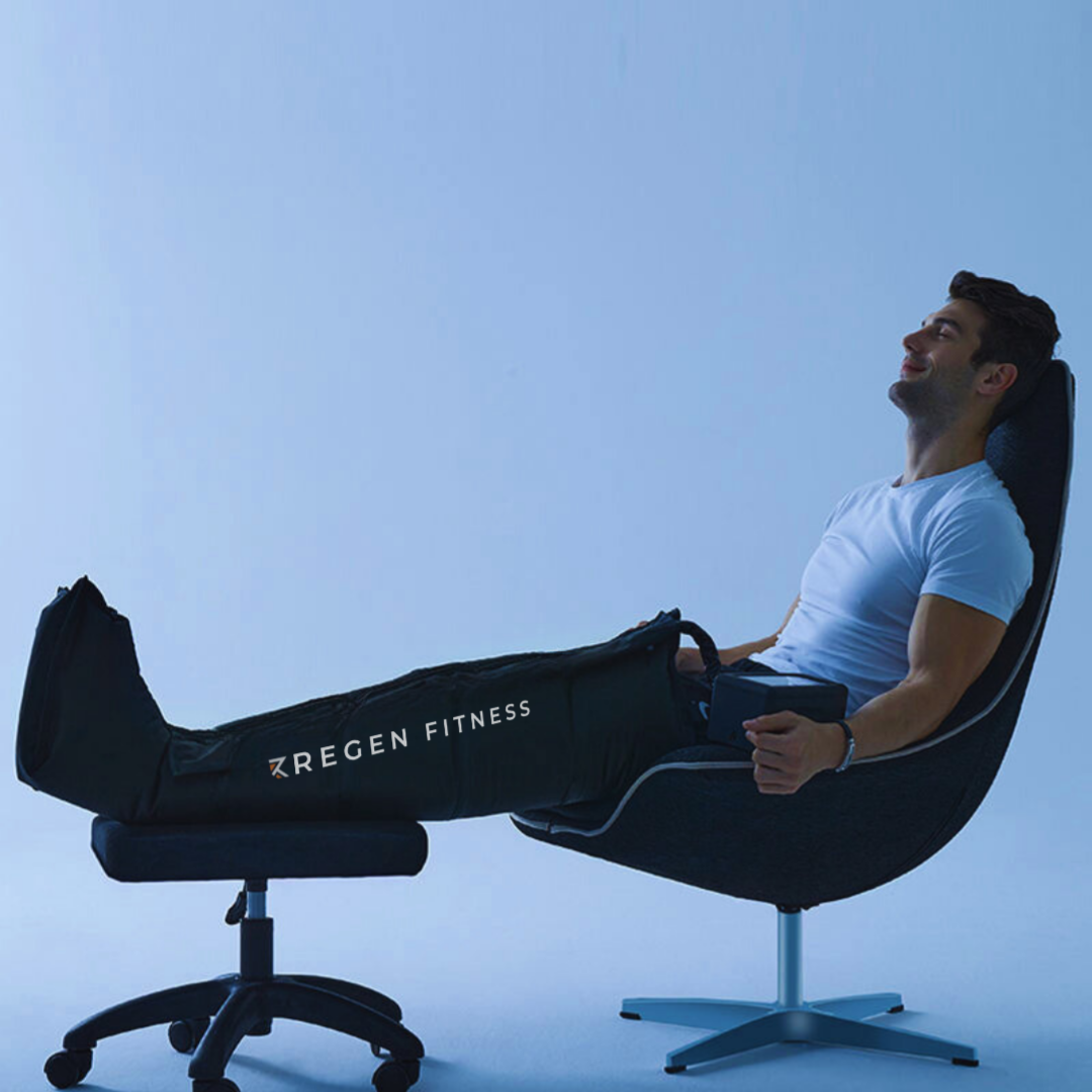 Man on chair wearing RegenAir compression boots for compression therapy.